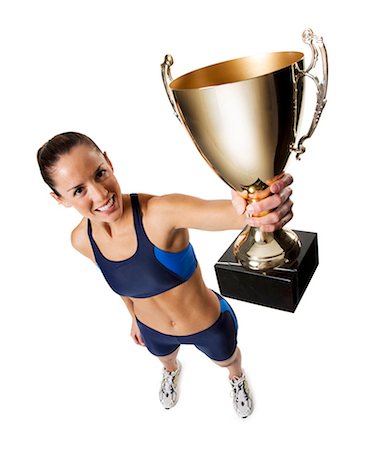 performer portrait white background - Woman athlete holding trophy Stock Photo - Premium Royalty-Free, Code: 640-03264487
