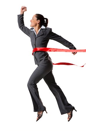 Businesswoman crossing finish line Stock Photo - Premium Royalty-Free, Code: 640-03264499