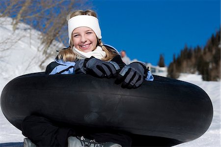 Girl with inner tube Stock Photo - Premium Royalty-Free, Code: 640-03264544