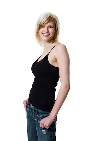 Woman standing with hand on pocket Foto de stock - Sin royalties Premium, Código: 640-03264642