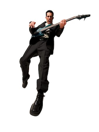 simsearch:640-02765362,k - Man jumping with electric guitar Stock Photo - Premium Royalty-Free, Code: 640-03264764