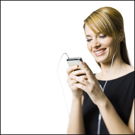earbuds - Femme avec appareil d'écoute et écouteurs Photographie de stock - Premium Libres de Droits, Code: 640-03264821