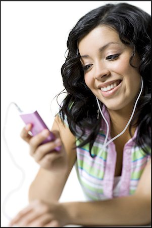 Teenage girl lying down with listening device Foto de stock - Sin royalties Premium, Código: 640-03264877