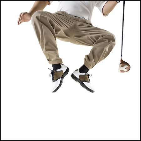 simsearch:640-03264970,k - Golfer jumping off the ground Stock Photo - Premium Royalty-Free, Code: 640-03264965
