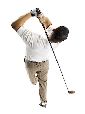 Golfer swinging club Stock Photo - Premium Royalty-Free, Code: 640-03264966