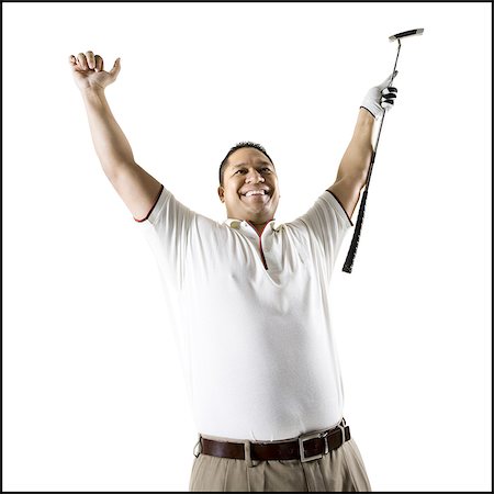 simsearch:640-03264970,k - Golfer raising arm and club Stock Photo - Premium Royalty-Free, Code: 640-03264967