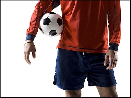 soccer player white background - Soccer player with ball Stock Photo - Premium Royalty-Free, Code: 640-03264985