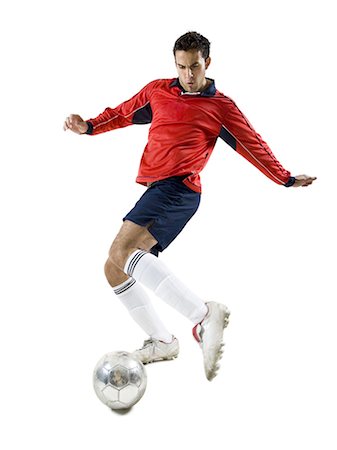 football kicking the ball - Soccer player kicking ball Stock Photo - Premium Royalty-Free, Code: 640-03264983