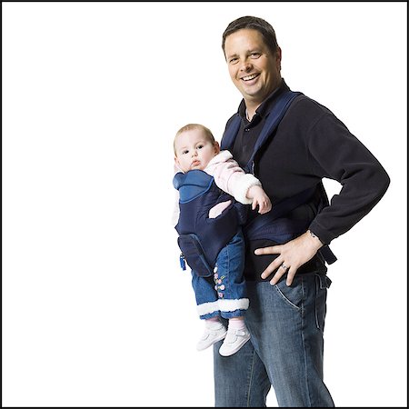 Father with baby in pouch Stock Photo - Premium Royalty-Free, Code: 640-03264998