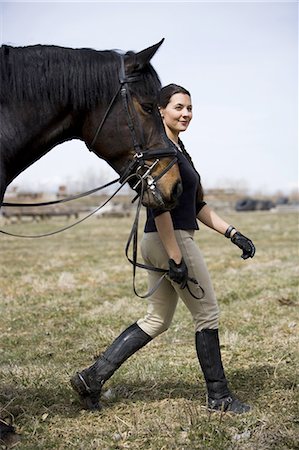 Woman walking with horse Stock Photo - Premium Royalty-Free, Code: 640-03265059