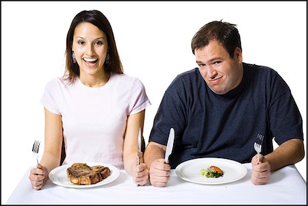 sad fat man - Couple eating lunch Stock Photo - Premium Royalty-Free, Code: 640-03265144