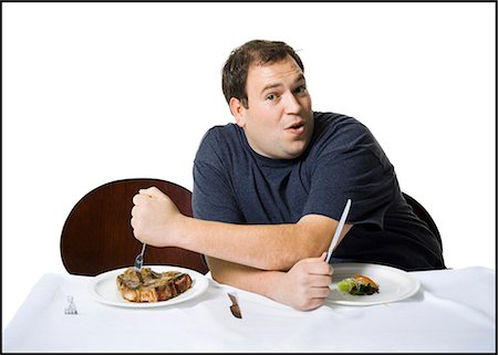 fat man looking at camera - Couple eating lunch Stock Photo - Premium Royalty-Free, Code: 640-03265145