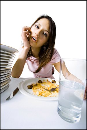 spaghetti & meatball - Woman engorging herself on spaghetti Stock Photo - Premium Royalty-Free, Code: 640-03265141