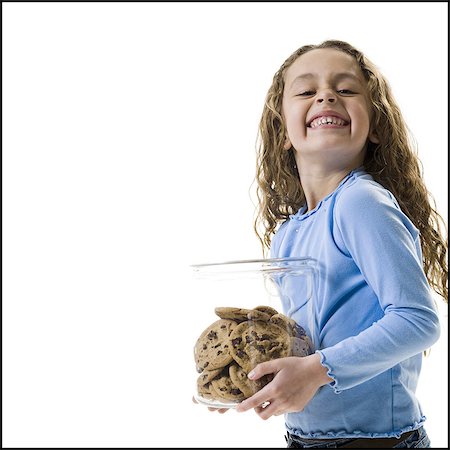 filou - Jeune fille tenant la jarre à biscuits Photographie de stock - Premium Libres de Droits, Code: 640-03265224