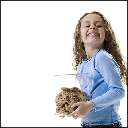 Young girl holding cookie jar Foto de stock - Sin royalties Premium, Código: 640-03265224