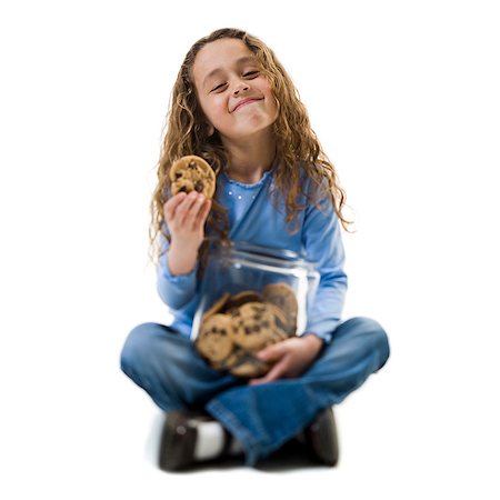 Young girl taking cookie from cookie jar Foto de stock - Sin royalties Premium, Código: 640-03265228