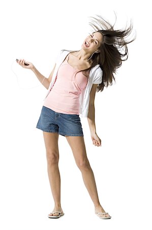 simsearch:640-03265297,k - Woman listening to MP3 player and dancing Stock Photo - Premium Royalty-Free, Code: 640-03265331