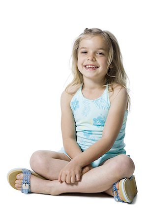 people sitting cutout white background - Young girl posing and sitting cross legged Stock Photo - Premium Royalty-Free, Code: 640-03265358