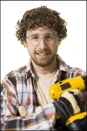 Carpenter with power tools Stock Photo - Premium Royalty-Free, Code: 640-03265379