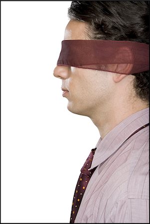 Close-up of a businessman wearing a blindfold Foto de stock - Sin royalties Premium, Código: 640-03265471