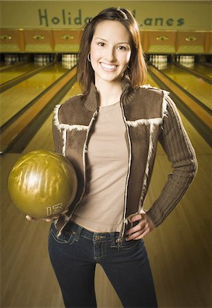 simsearch:640-03265586,k - Portrait of a teenage girl holding a bowling ball and smiling Stock Photo - Premium Royalty-Free, Code: 640-03265542