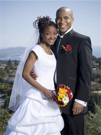 Portrait d'un couple de jeunes mariés sourire ensemble Photographie de stock - Premium Libres de Droits, Code: 640-03265670