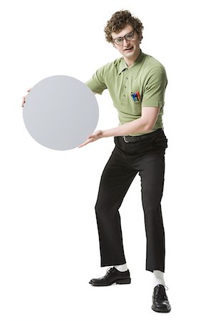 simsearch:640-03258417,k - Nerdy guy holding blank sign Stock Photo - Premium Royalty-Free, Code: 640-03265773