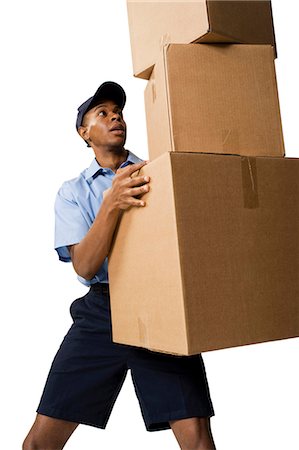 retrieval - Deliveryman holding parcels Stock Photo - Premium Royalty-Free, Code: 640-03260060