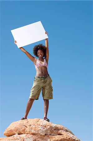 person holding blank sign - Woman with blank sign Stock Photo - Premium Royalty-Free, Code: 640-03260085