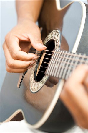 Man playing guitar Stock Photo - Premium Royalty-Free, Code: 640-03260251
