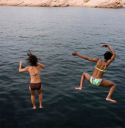 diving jumping into water - Women jumping into water Stock Photo - Premium Royalty-Free, Code: 640-03260287