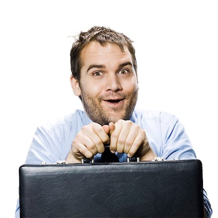 disheveled looking man with a briefcase Stock Photo - Premium Royalty-Free, Code: 640-03260395