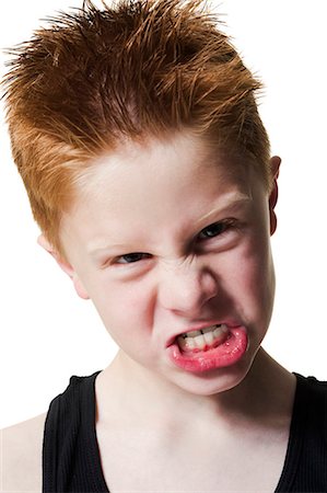 simsearch:640-03258417,k - Boy pulling funny face Stock Photo - Premium Royalty-Free, Code: 640-03260426