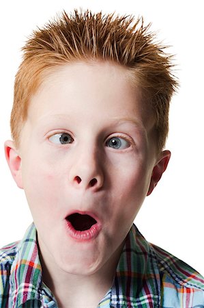 funny faces kids - Boy pulling funny face Stock Photo - Premium Royalty-Free, Code: 640-03260432