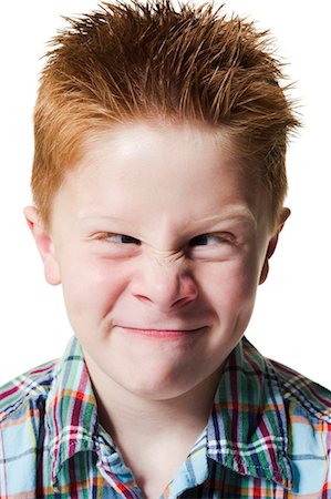 funny faces kids - Boy pulling funny face Stock Photo - Premium Royalty-Free, Code: 640-03260433