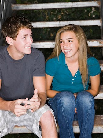 teenagers flirting on a stairway Stock Photo - Premium Royalty-Free, Code: 640-03260488