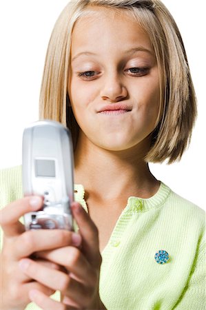 Girl using cell phone Stock Photo - Premium Royalty-Free, Code: 640-03260505