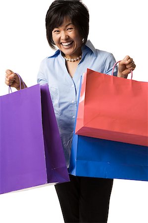 simsearch:640-02770635,k - Woman holding shopping bags Stock Photo - Premium Royalty-Free, Code: 640-03260694