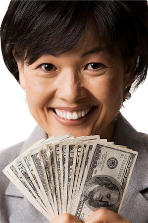 simsearch:640-03260699,k - Portrait of woman holding US banknotes Foto de stock - Sin royalties Premium, Código: 640-03260700