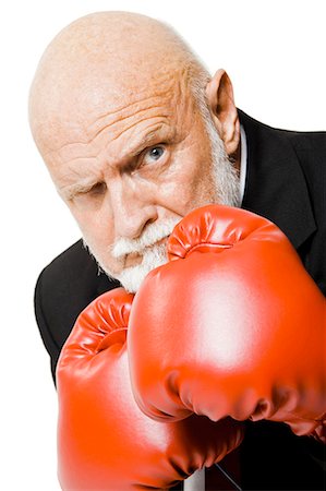 Businessman with boxing gloves Stock Photo - Premium Royalty-Free, Code: 640-03260857