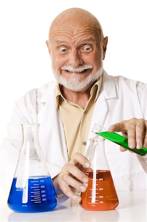 Scientist pouring chemicals Stock Photo - Premium Royalty-Free, Code: 640-03260865