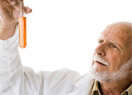Scientist with chemicals in test tubes and beakers Stock Photo - Premium Royalty-Free, Code: 640-03260870