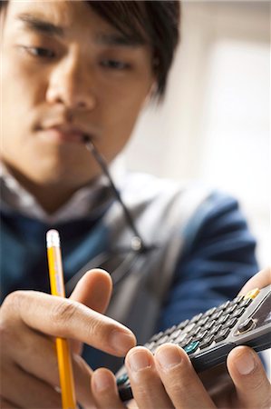 simsearch:640-03261483,k - Closeup of student with calculator Stock Photo - Premium Royalty-Free, Code: 640-03261136