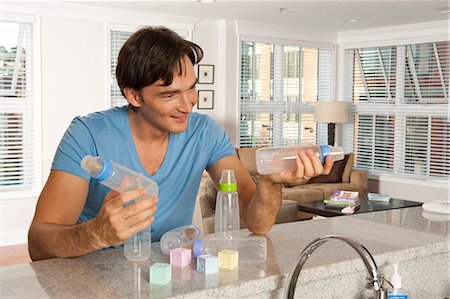 simsearch:640-02771097,k - Man with baby bottles and blocks Stock Photo - Premium Royalty-Free, Code: 640-03261362