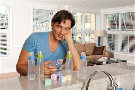 simsearch:640-02771097,k - Man with baby bottles and blocks Stock Photo - Premium Royalty-Free, Code: 640-03261363