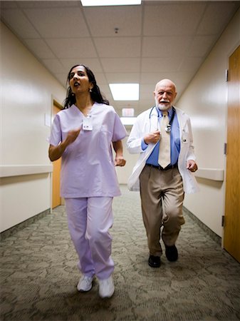 doctors walking in hallway - Medical consultation Stock Photo - Premium Royalty-Free, Code: 640-03261416
