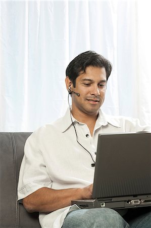 simsearch:640-02775245,k - Man with earphone listening Stock Photo - Premium Royalty-Free, Code: 640-03261445