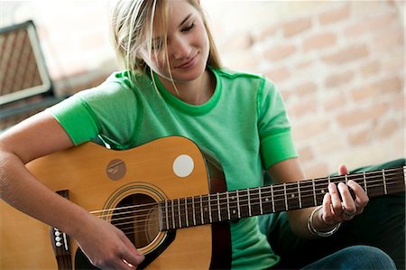 playing guitar close up - Woman holding guitar Stock Photo - Premium Royalty-Free, Code: 640-03261465