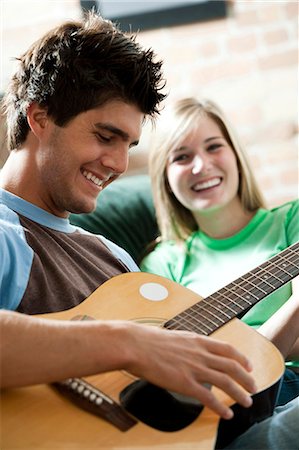 female singer guitar - Man singing with guitar for woman Stock Photo - Premium Royalty-Free, Code: 640-03261471
