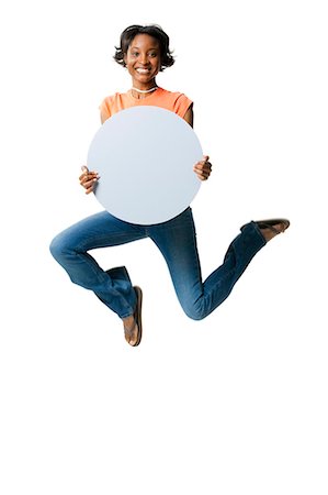 simsearch:640-03262060,k - Woman leaping with blank sign Stock Photo - Premium Royalty-Free, Code: 640-03261573